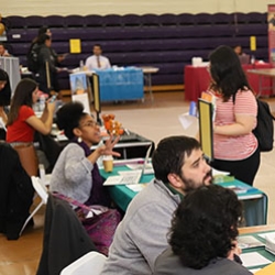 Recruiters at career fair answering questions