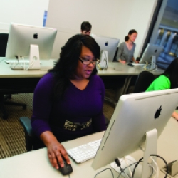 student using computer in Business lab